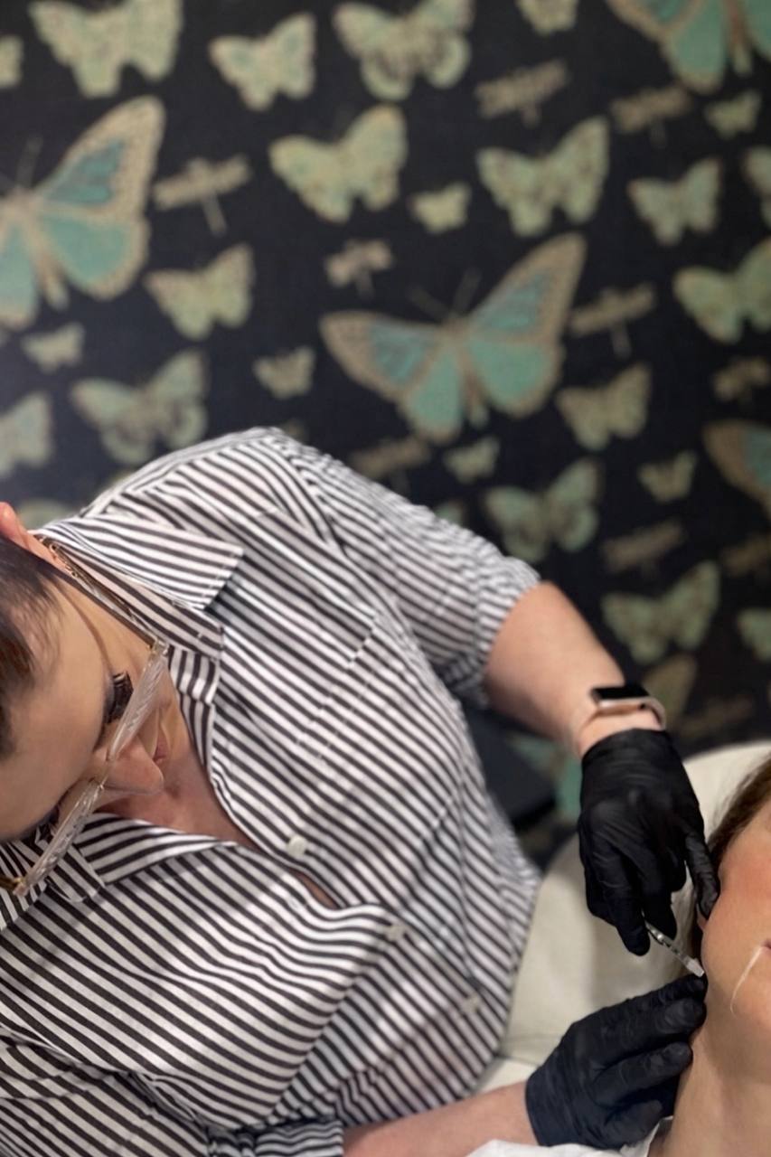 Katie Dalessi administering injectable treatment at Bleu MedSpa